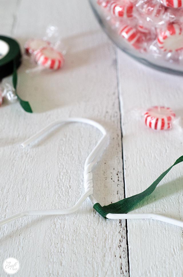 floral tape anchored to a wire clothes hanger
