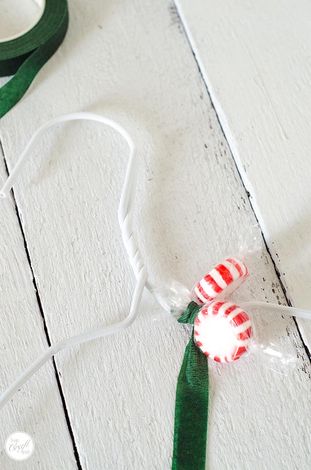 attaching candies to a candy wreath