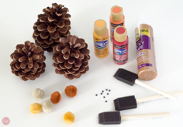 pinecones, paint, brushes, pom poms, googly eyes, and glue = easy supplies for a really cute pinecone turkey craft